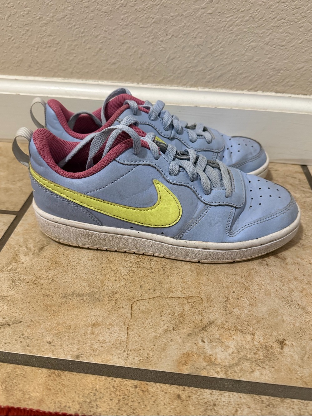 Nike Kids Light Blue Low-Top Sneakers with Yellow Swoosh and Pink Lining